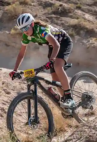 Female Niwot rider descends the final switchbacks at Eagle