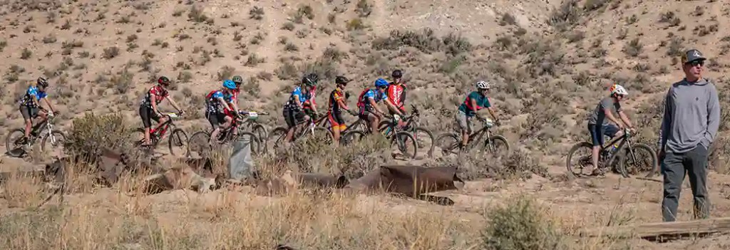 The Saint Vrain High School MTB team rides in warmup at one of the race venues
