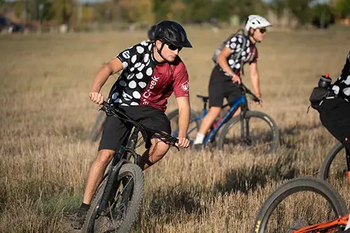 Silver Creek and St. Vrain MTB riders practice cornering during coached drills
