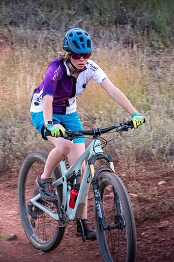 Female rider in fall at practice